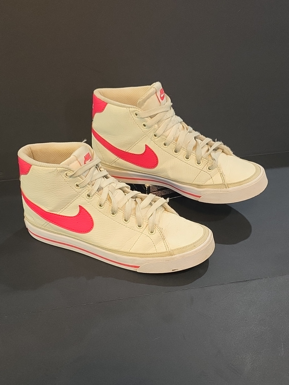 Nike Women’s High-Top Sneakers in Cream with Pink Swoosh